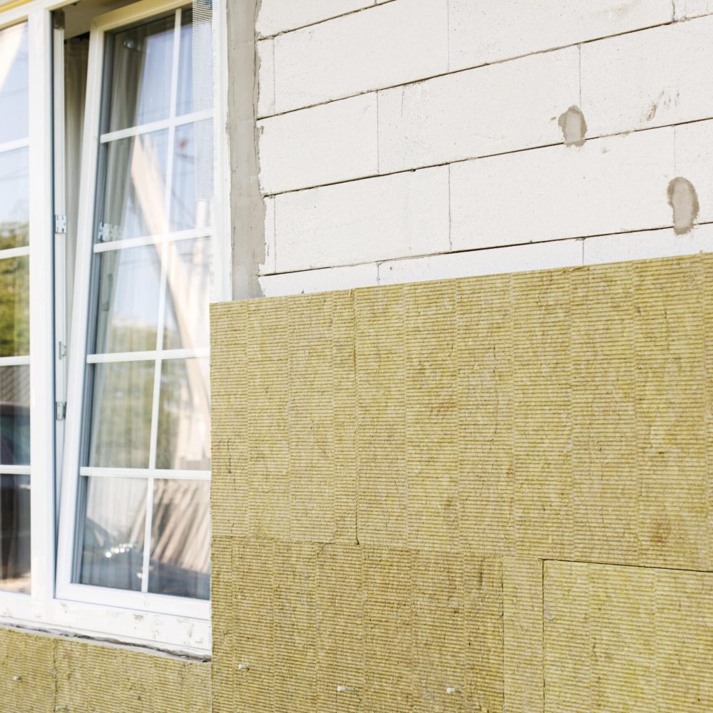 house-insulation-concept-facade-insulation-with-mineral-wool-thermal-improvement-energy-saving-modern-farmhouse-renovation-covering-with-stone-wool-panels-close-up (1)-min house-insulation-concept-facade-insulation-with-mineral-wool-thermal-improvement-energy-saving-modern-farmhouse-renovation-covering-with-stone-wool-panels-close-up (1)-min