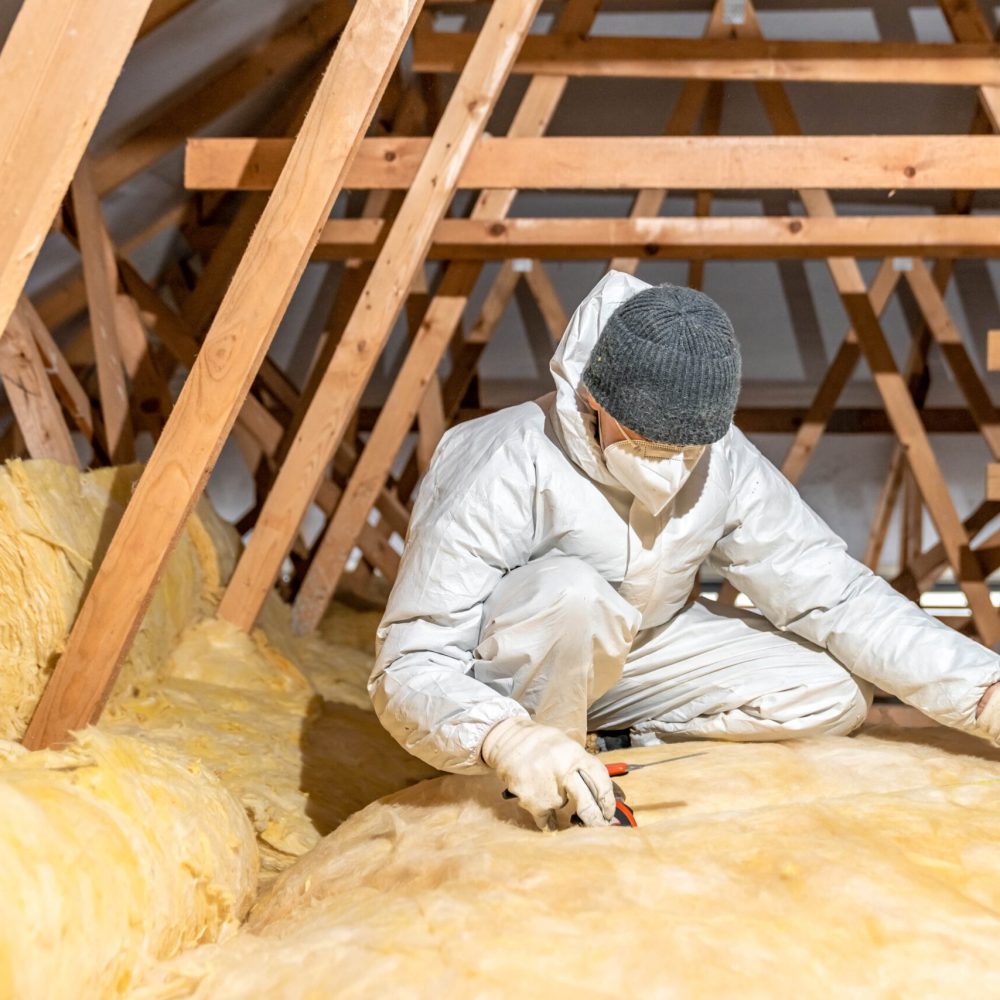 low-angle-view-man-sitting-roof-min